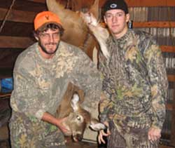 Hunters with deer